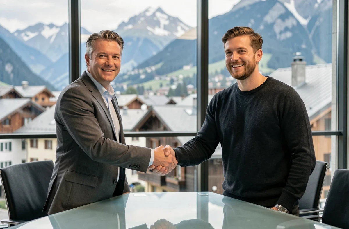 Deux professionnels signant un accord de location de bureau en Haute-Savoie dans une salle de réunion avec vue sur la montagne